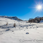 Piano Toscano e sullo sfondo il Varco del Pollino divide Serra delle Ciavole da Serra Dolcedorme